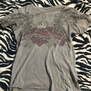 grey sinful shirt has little holes in front